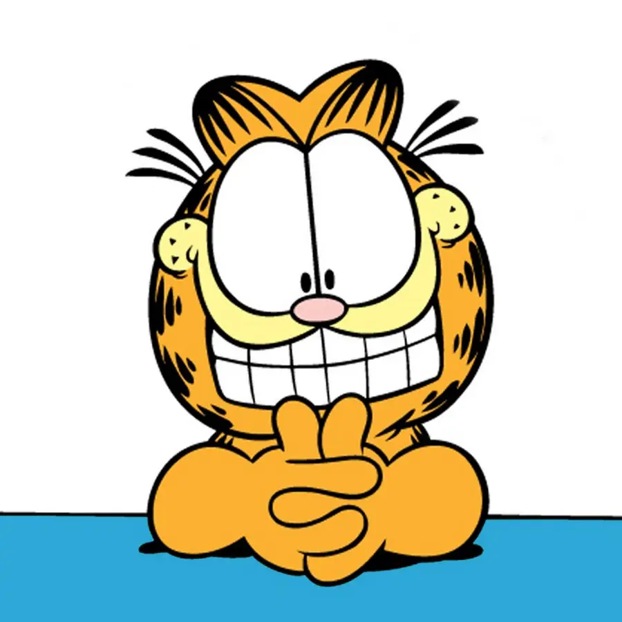 Garfield smiling with his arms up on a table